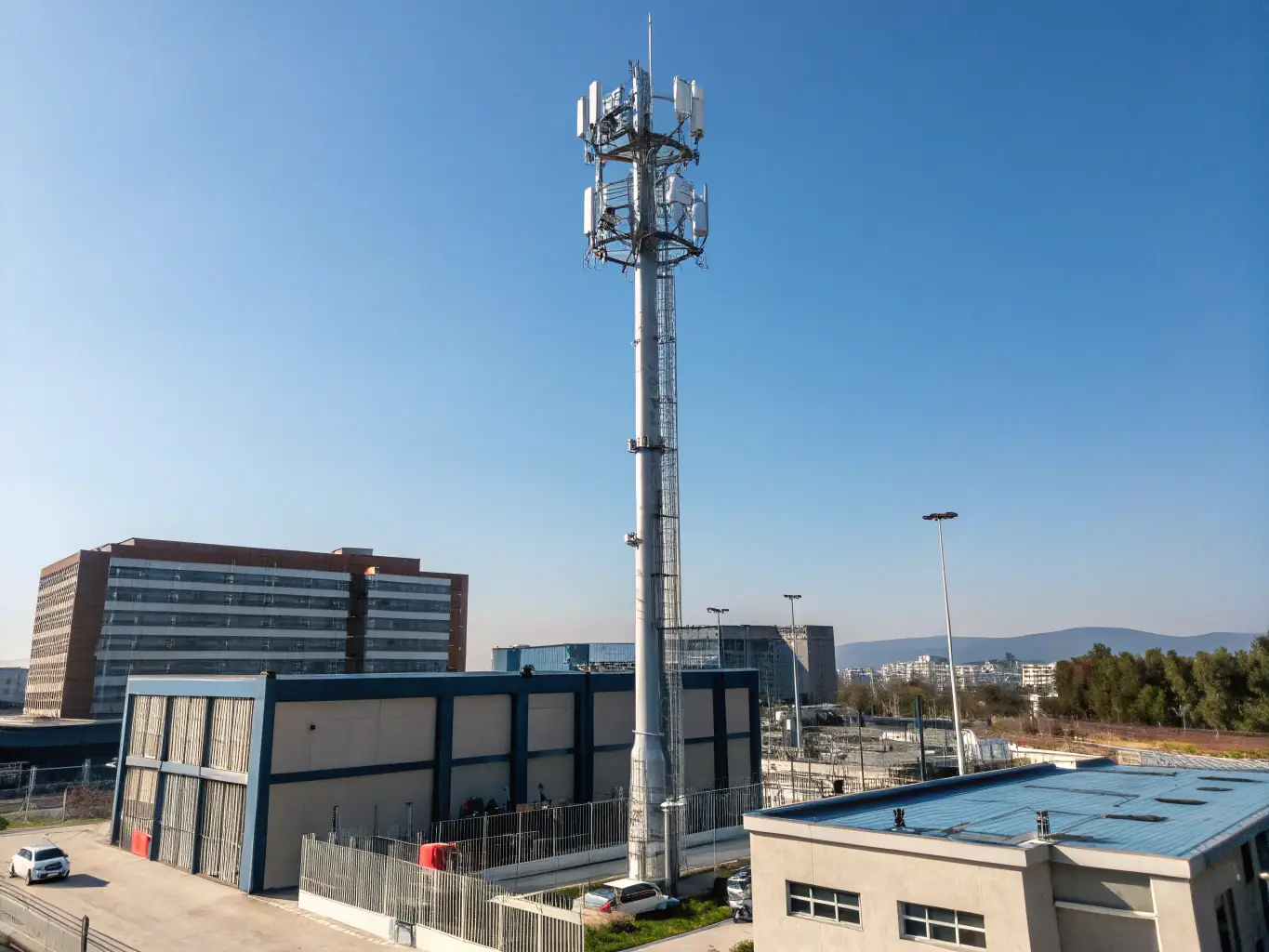 A detailed image showcasing a 5G cell tower installation in a bustling urban environment, emphasizing the high-tech nature and connectivity benefits of REGINTEL & CelinTech's 5G solutions.